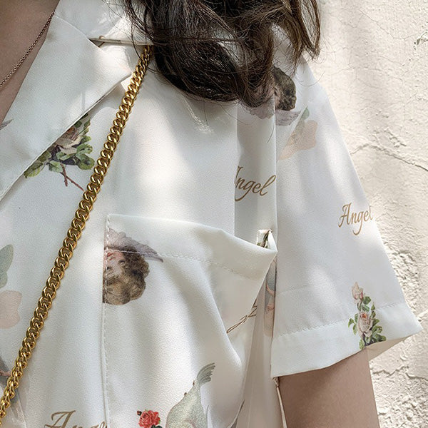 Twin angels' white shirt