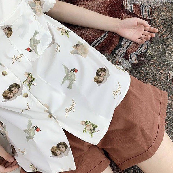 Twin angels' white shirt