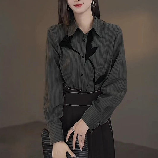 A single flower, pinstripes